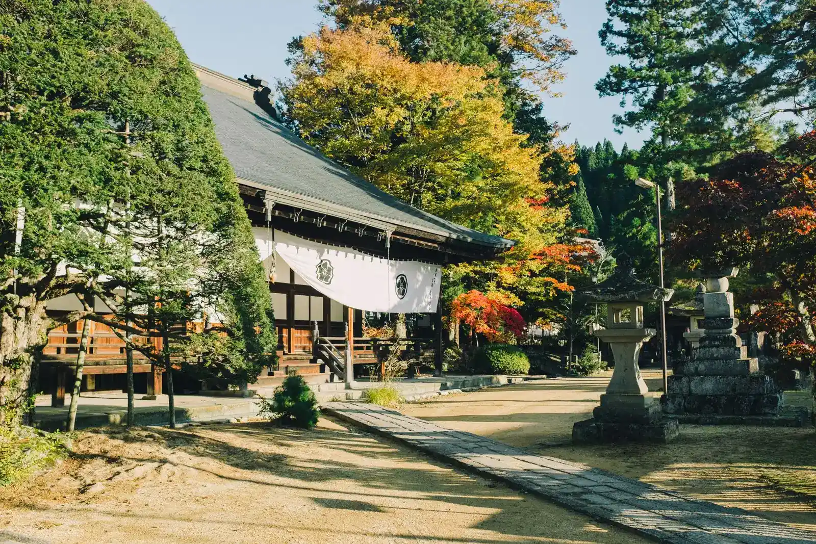Tensho-ji temple hall among autumn trees in Takayama's Higashiyama area