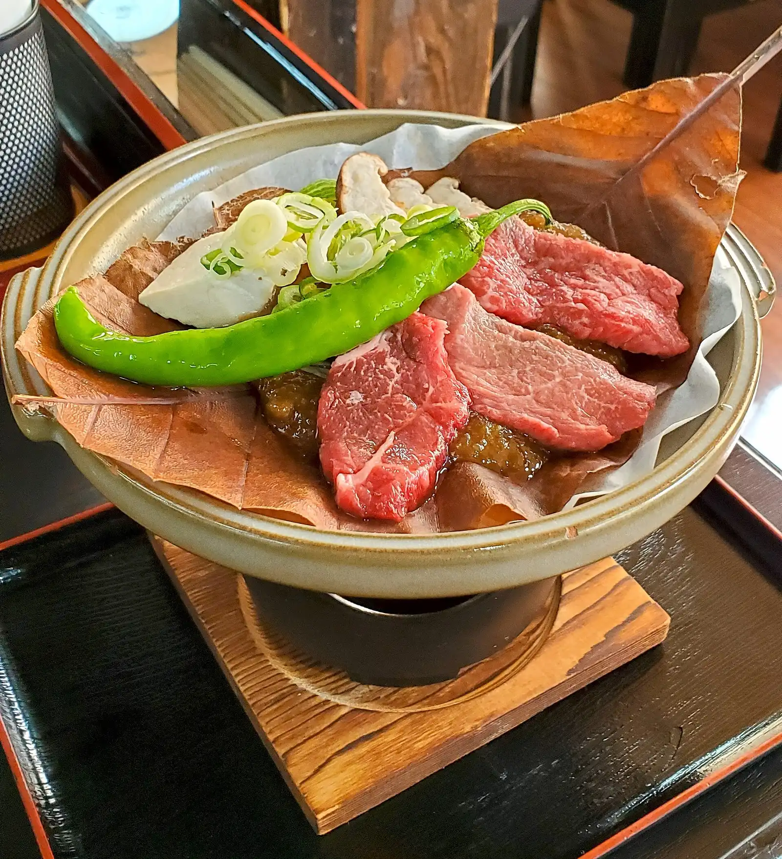 Hoba miso: miso and Hida beef grilling on a dried magnolia leaf over a small burner