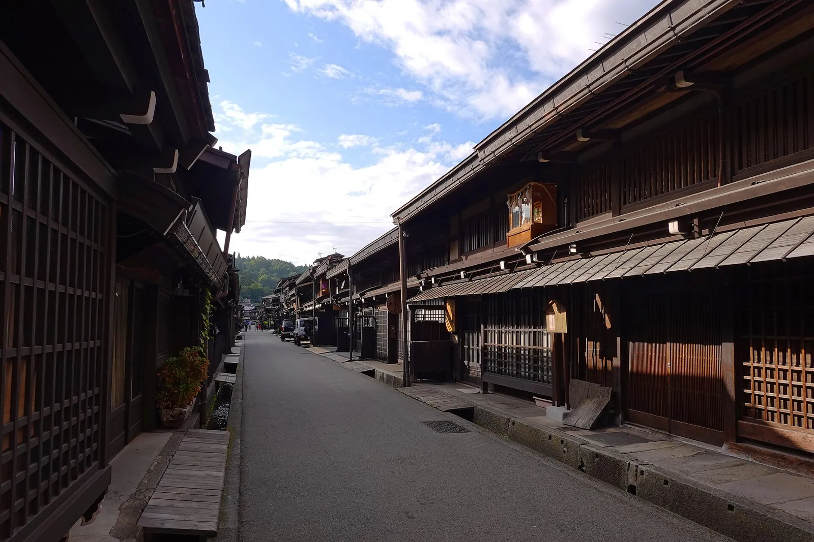 Shaded Sanmachi lane with deep eaves and water channels along both sides