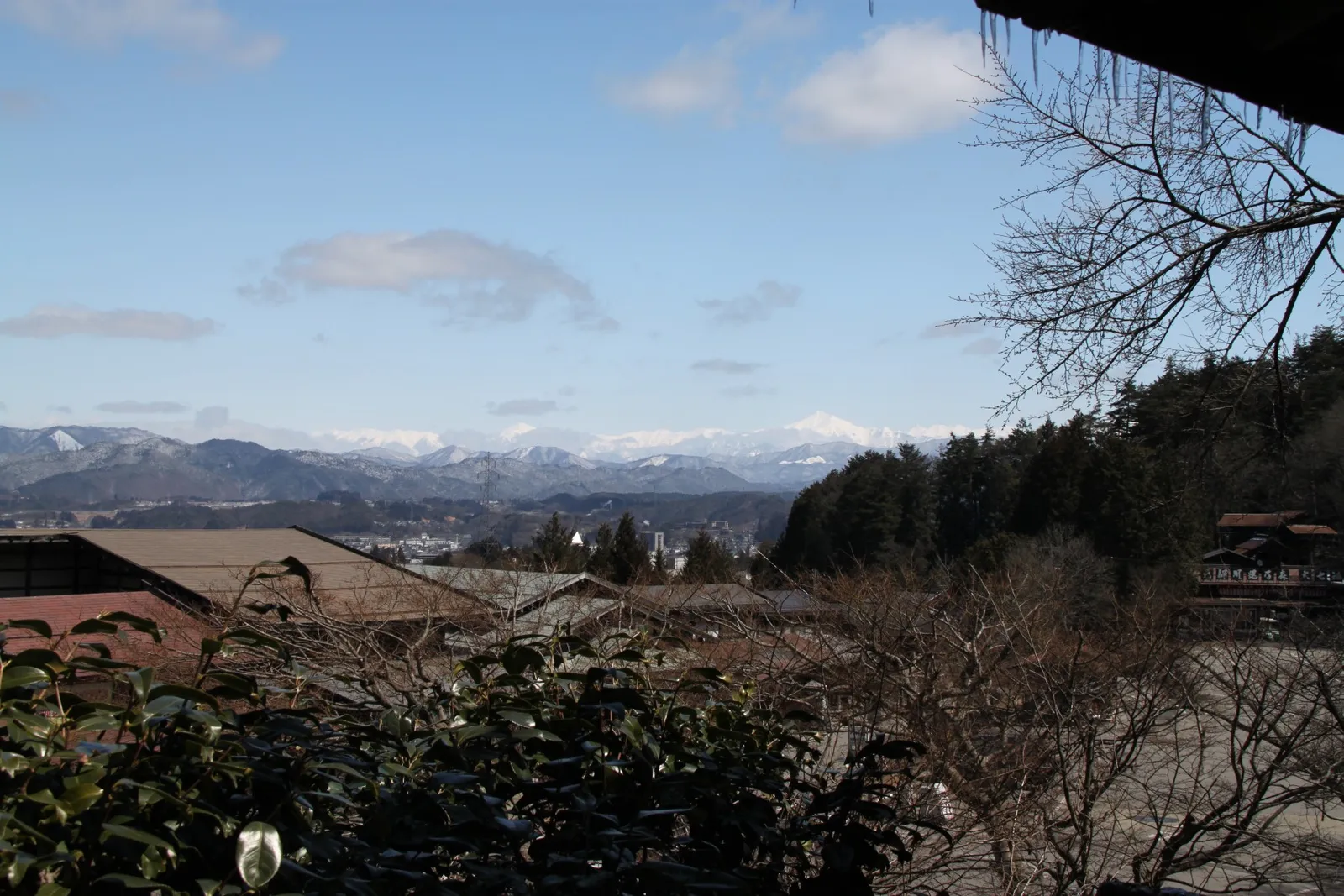 View over Takayama to the snow-capped Northern Alps from the hill by Hida Folk Village
